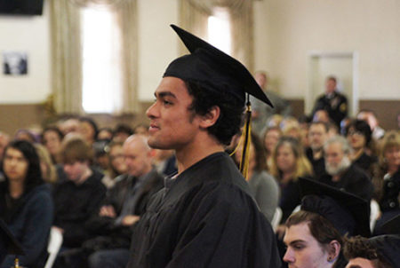 student with cap and gown