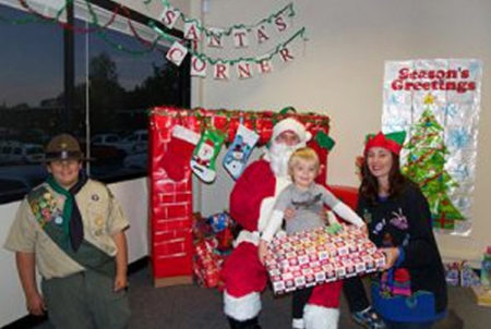 santa claus with two elves and a child